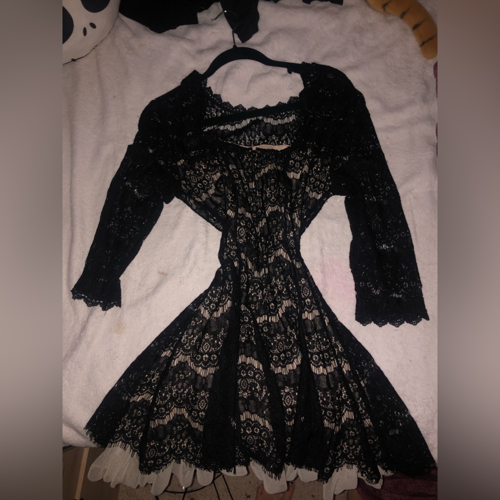 gothic elegant black lacey dress. ruffles on bottom
